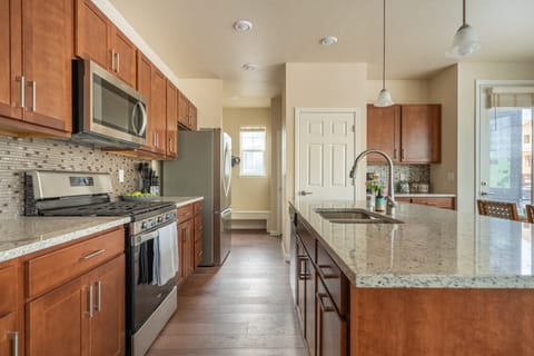 Roomy kitchen with spacious marble countertops