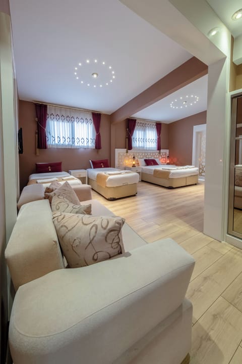 Deluxe Quadruple Room | Premium bedding, free minibar items, desk, laptop workspace