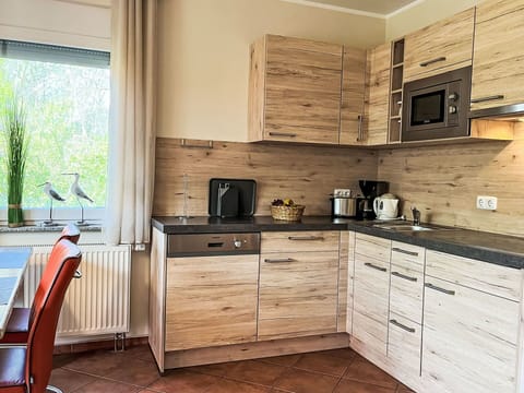 Furniture, Wood, Cabinetry, Interior Design, Flooring, Drawer, Floor, Kitchen, Countertop, Room