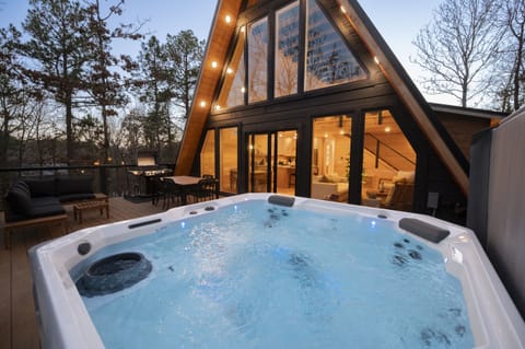Hot Tub Retreat: Unwind in style with stunning views and great outdoor living space!