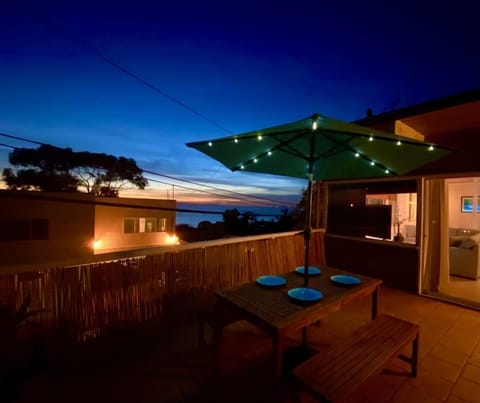 Outdoor dining on deck with a view of the sunsets