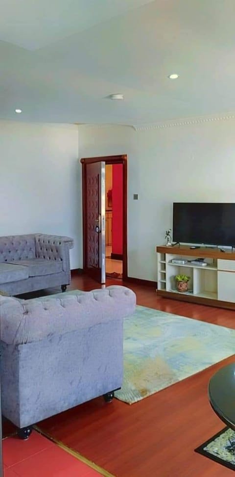 Business Apartment | Living area | 24-inch Smart TV with digital channels