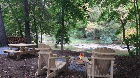 "Sitting next to the river, watching the fire was real FUN! It felt like camping without the inconvenience of real camping."  ...Lina  --  "the fire pit and creek are like a private oasis in the backyard." ... Nachama -- ( no firewood fees )