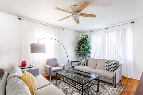 SpaciouCozy and spacious living room with natural light.s lounge, modern entertainment, cozy furnishings.