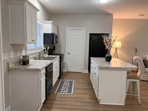 Kitchen with 4 counter stools, large pantry and keurig 