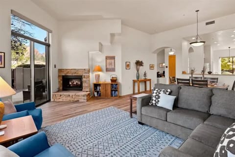 Airy, yet cozy, the open living and dining area has tons of natural light.