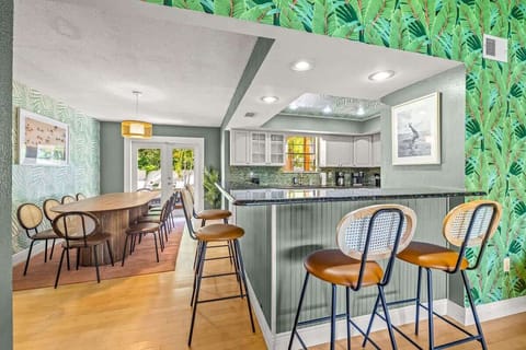 Plenty of seating options for friends and family to gather around the dining table and kitchen