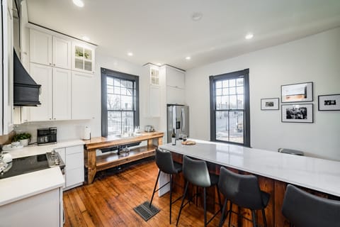 Kitchen includes stainless fridge, range/oven, microwave, dishwasher and sink.