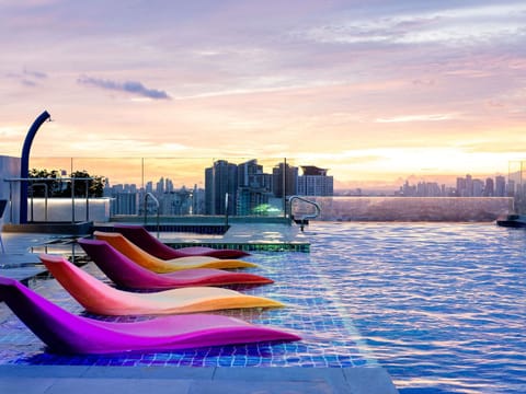 2 outdoor pools, open 8:00 AM to 7:00 PM, pool umbrellas