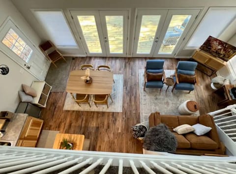 Views the upstairs balcony (where the master bedroom is located).