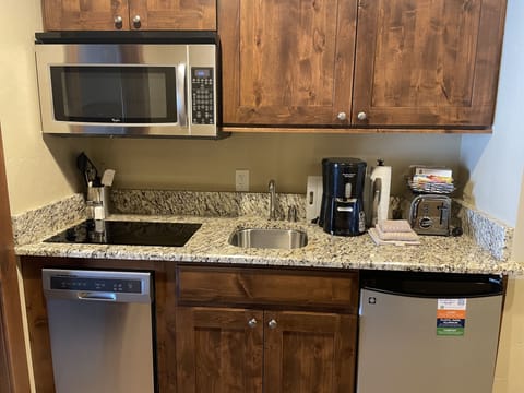 Undercounter frig and dishwasher, cooktop, microwave, and other appliances.
