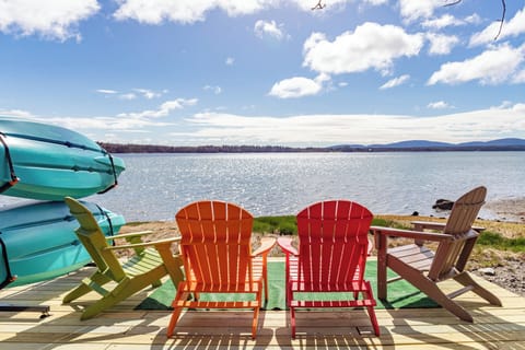 Sitting area by the beach with our complimentary kayaks. 