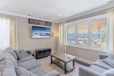 Large Picture Window in Living Room with Mountain Views