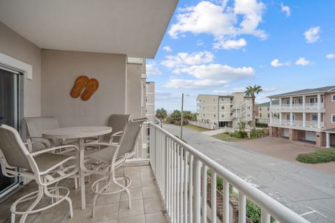 Balcony with ocean view (side); table with seating for four and two addl chairs;