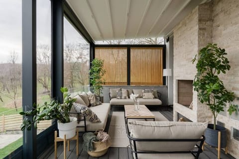 Outdoor terrace lounge with outdoor fire place, BBQ facilities and sitting area
