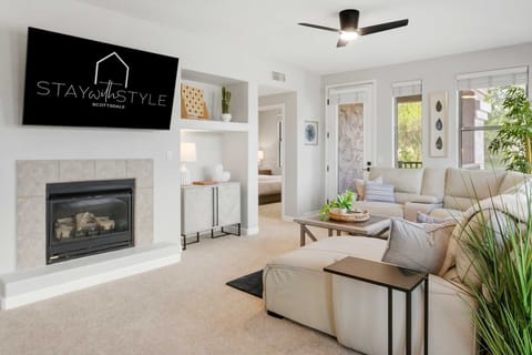 Comfortable living room with fireplace, games, and sectional