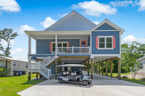 Welcome to our Home! plus a golf cart for the short distance to the beach.