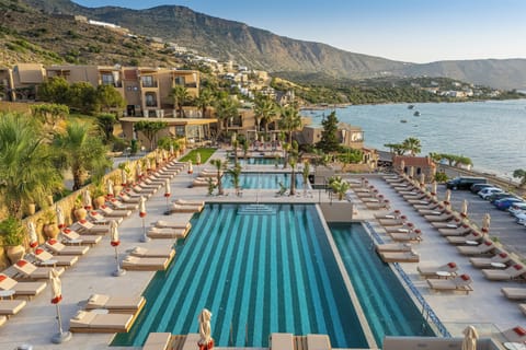 Seasonal outdoor pool, open 8:00 AM to 8:00 PM, pool umbrellas