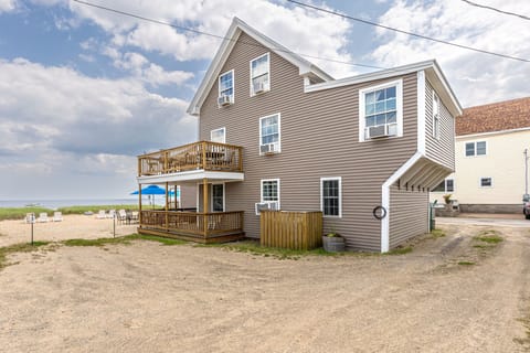 Rear side of the cottage, showing some of the parking lot. 