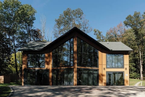 A beautiful house with large windows that fill the interior with natural light.