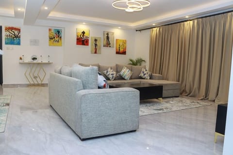 Comfort Apartment | Living area | 24-inch Smart TV with digital channels