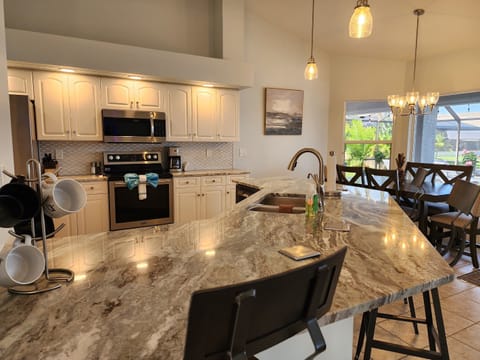 Kitchen with view of the lake & pool