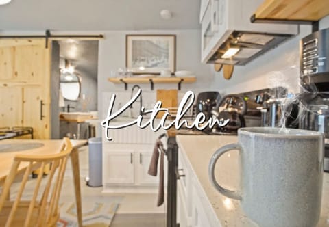 The kitchen exudes comfort, with warm wood accents and a layout designed for easy, enjoyable cooking