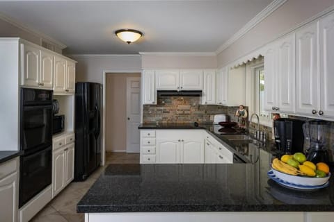 Modern Kitchen with 2 ovens fully stocked to prepare your meals