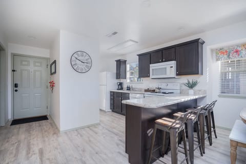 Whip up a delicious meal in the fully equipped kitchen - the heart of your cozy condo that's sure to inspire your inner chef!