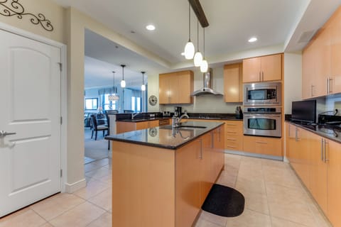 Large gourmet kitchen with solid surface cooktop, oven, microwave & pantry