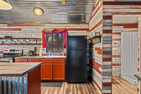 Refrigerator is provided as well as a sink area that overlooks the back yard.