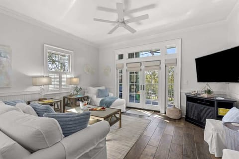 Overstuffed sofa and chaise with lots of light from transom windows