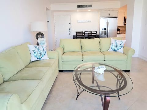 Living room of the 1 bed/ 1.5 bath unit. Two full length sleeper sofas