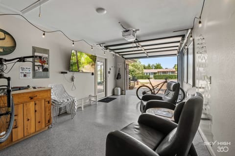 Dream garage for cyclists: lounge area, bike storage, repair stand, TV, & more!
