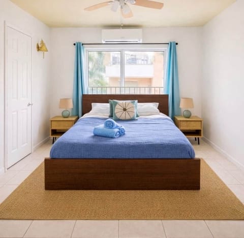 Clean coastal feel with a calm aesthetic. It’s bright, simple, and inviting.

* Beach-inspired / coastal decor with shades of blue, sand, and white
* Minimalist layout with uncluttered surfaces
* Warm wood tones balance the cool blues
