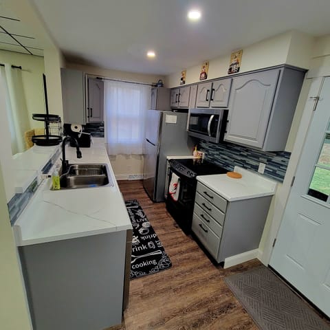 fully stocked kitchen with electric stove