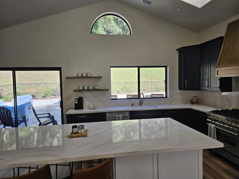 Open kitchen with slider out to pool