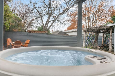 Enjoy a cozy evening soak in the backyard hot tub under the stars.