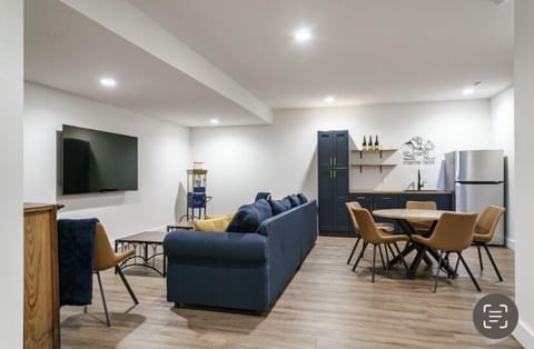 Furnished basement with wet bar, games and popcorn maker