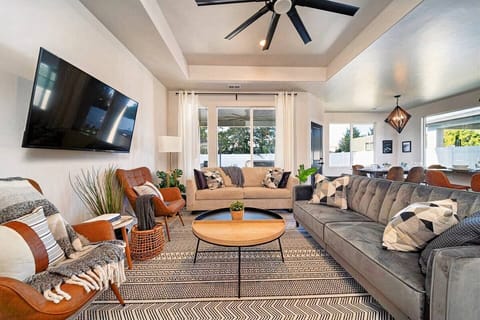 Spacious living room that marries comfort with contemporary design, perfect for both lively social evenings and quiet nights in