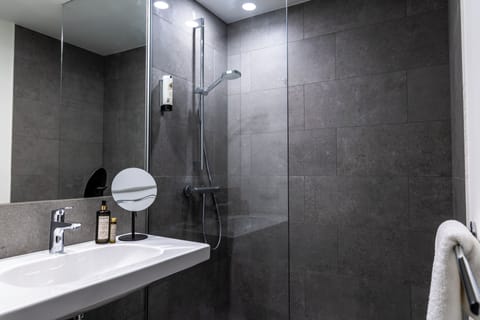 Shower, free toiletries, hair dryer, slippers