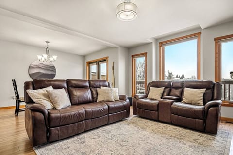 Living room with an electric fireplace and a ROKU Smart TV with cozy couches to kick back after a day of adventures