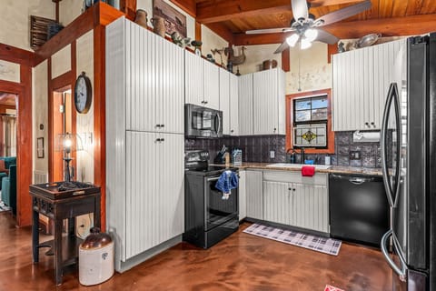 Welcome to our unique and charming kitchen, where creativity meets practicality in every corner.