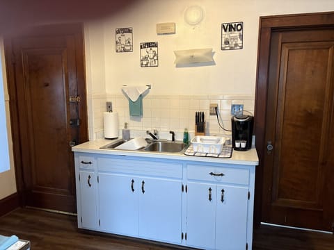 Full kitchen with refrigerator, stove and microwave