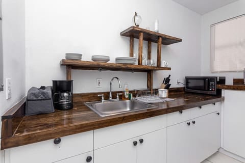 Kitchen prep area with coffee maker and cooking essentials