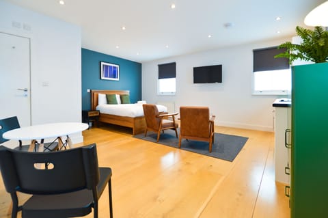 Standard Studio Apartment | Living area | Flat-screen TV, heated floors