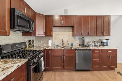 The kitchen is stocked with utensils, dinnerware and pots & pans so you can create a delicious meal.