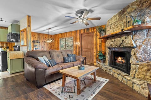 Relax on the comfy couch and watch TV or turn on the electric fireplace insert.