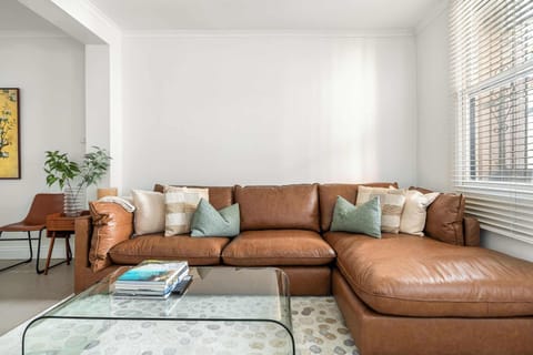 Our premium leather couch adds a touch of elegance to the living area—complete with a high-definition TV for your entertainment.