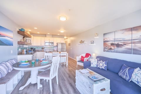 Living room with conjoined dining room and kitchen.